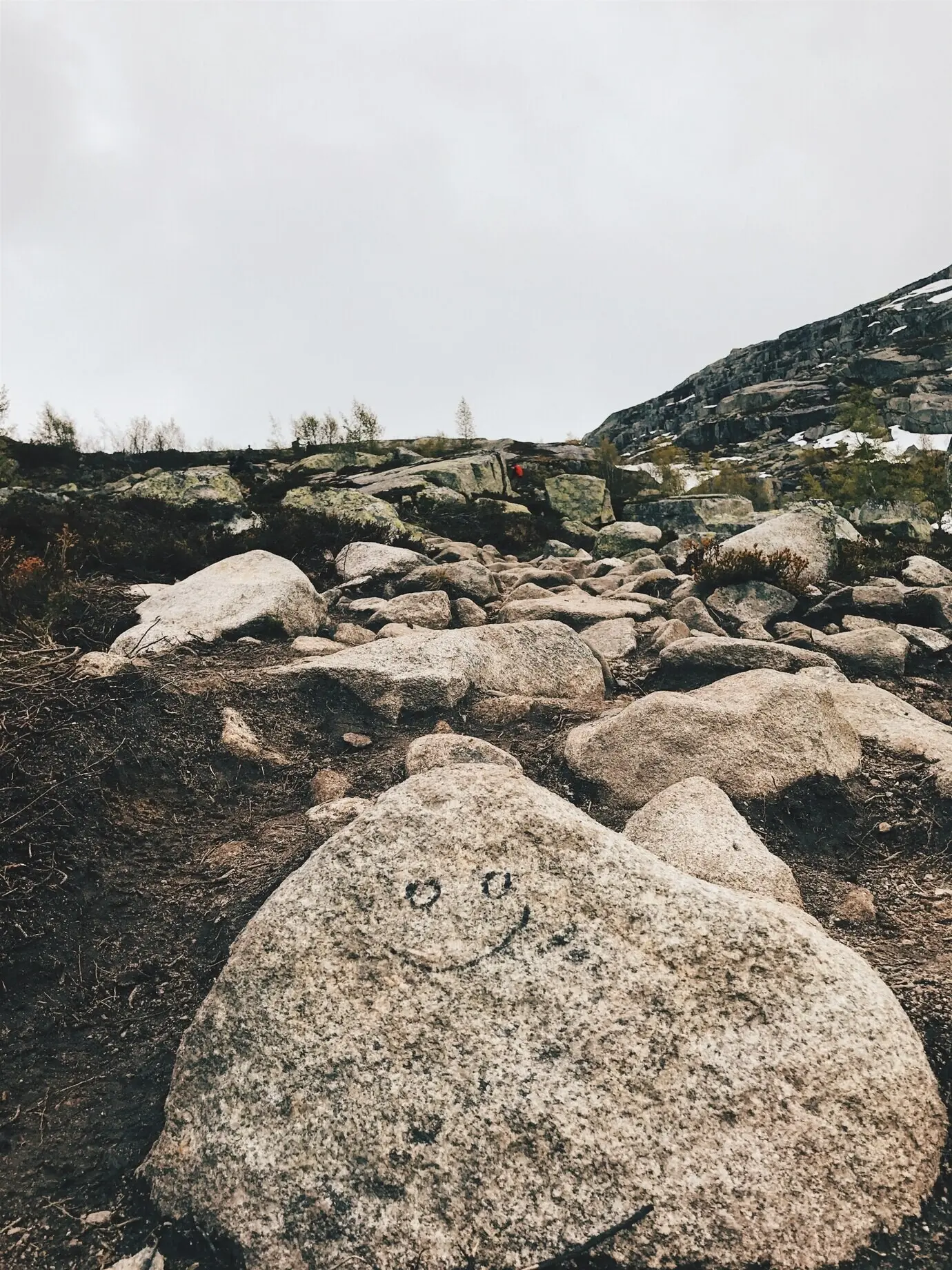 Large rocks rest amid the mountains.